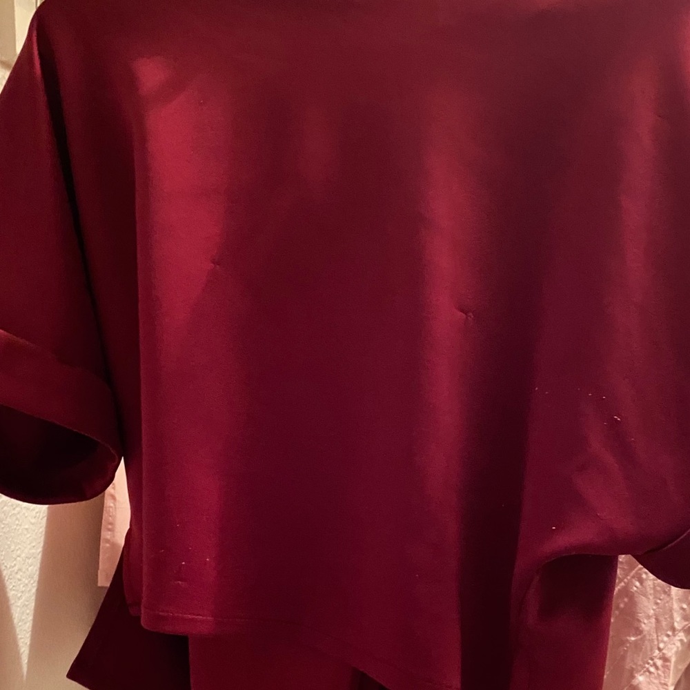 Top and pants are same color the pants is mid